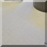 D10. Cream-colored woven rug. Measures approx. 12'4” x 10' 